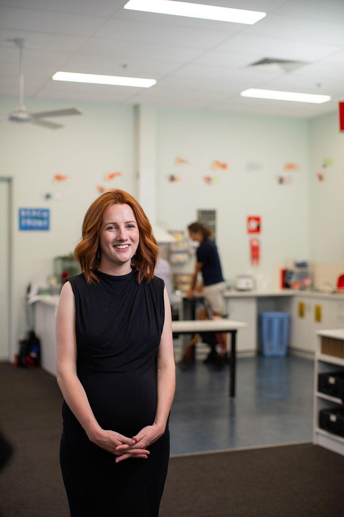 Woman in her workplace smiling